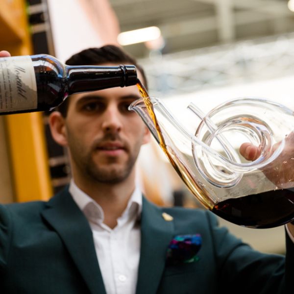 Sommelier decanting wine